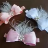 Hair Accessory with feathers and pearl center