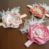 Hair accessory with satin flower, pearls and feathers