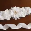 White flower sash with rhinestones and pearls