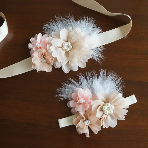 Flower and feather sash with champagne and peach flowers