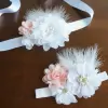 Flower and feather sash with white and peach flowers 