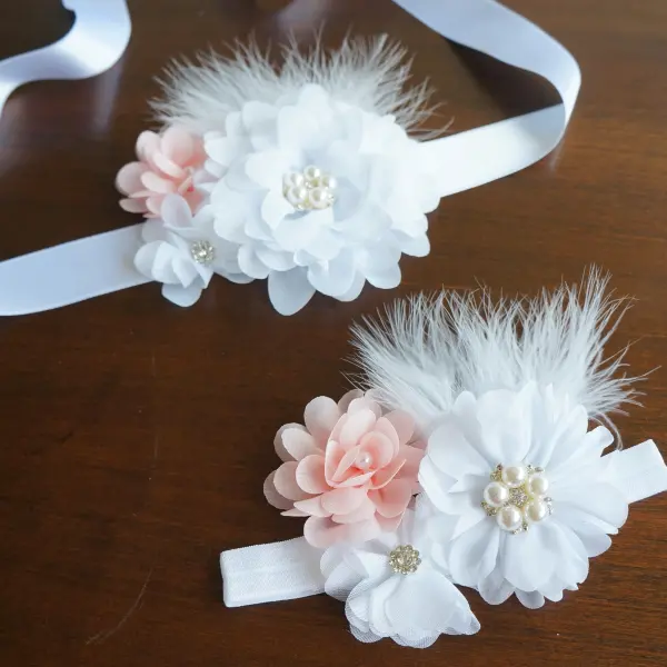 Flower and feather sash with white and peach flowers 