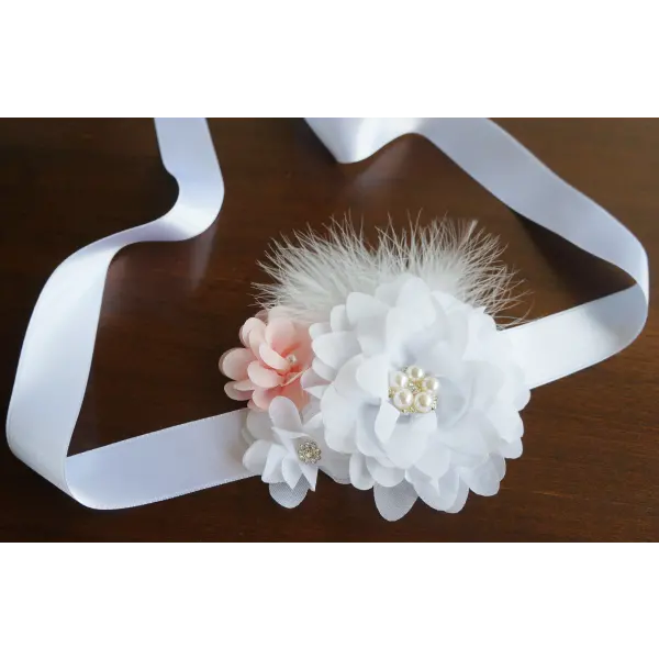 Flower and feather sash with white and peach flowers 