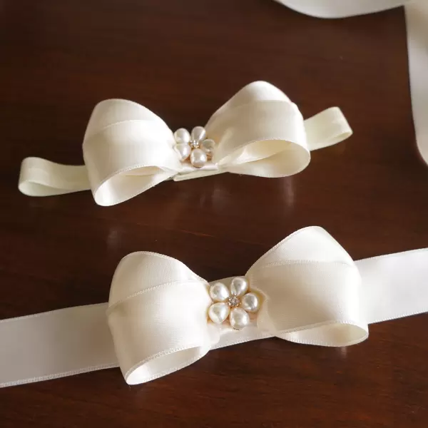 Handmade satin bow sash with pearl center