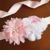 White sash with satin and chiffon flowers