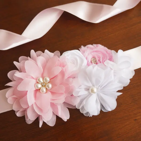 White sash with satin and chiffon flowers